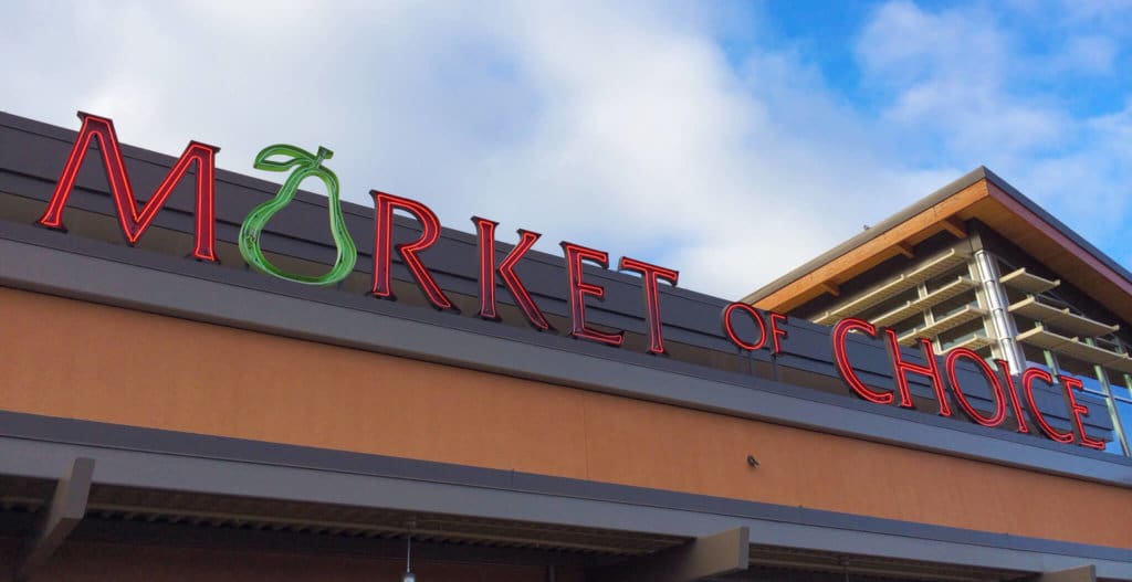 Eugene, OR, USA - January 3, 2014: Market of Choice entrance sign. Market of Choice is a supermarket chain emphasizing organic and natural groceries.